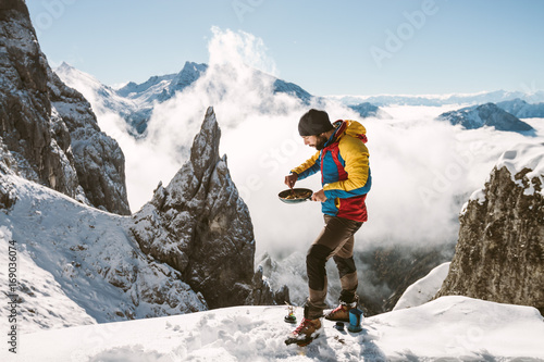 Portrait of male mountaineer having scrambled eggs for breakfast 