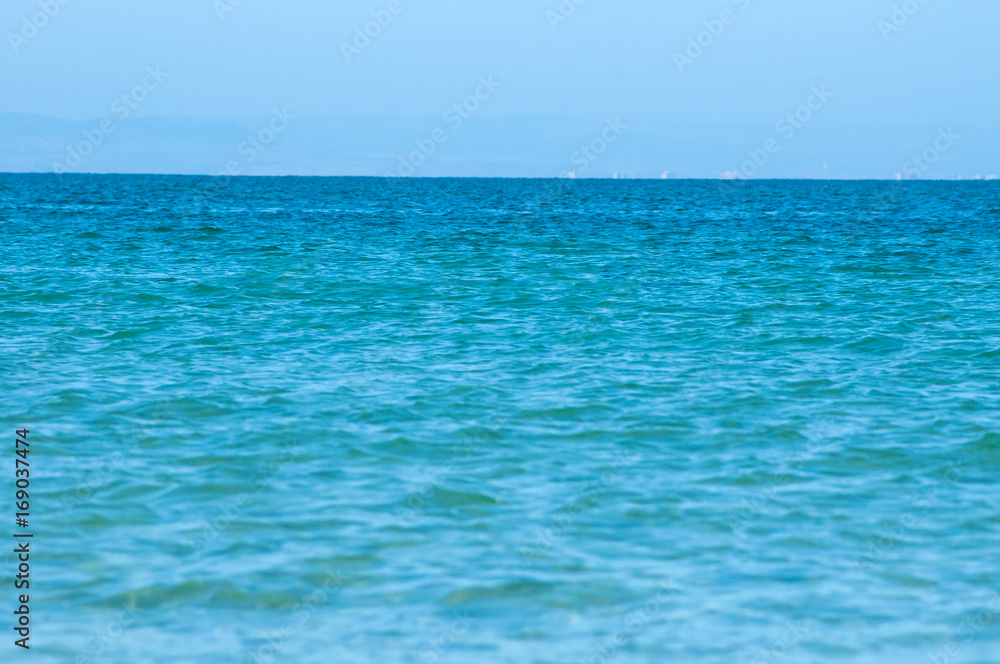 Perfect turquoise sea and blue sky in the summer.