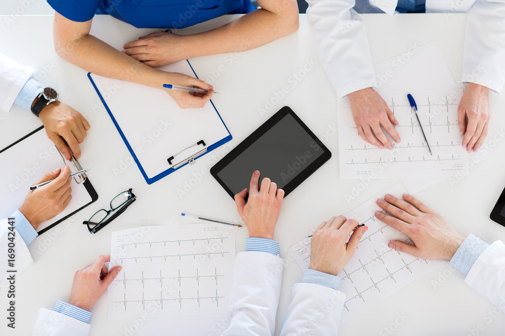 doctors with cardiograms and tablet pc at hospital doctors with cardiograms and tablet pc at hospital