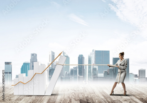 Businesswoman pulling graph with rope as concept of power and control