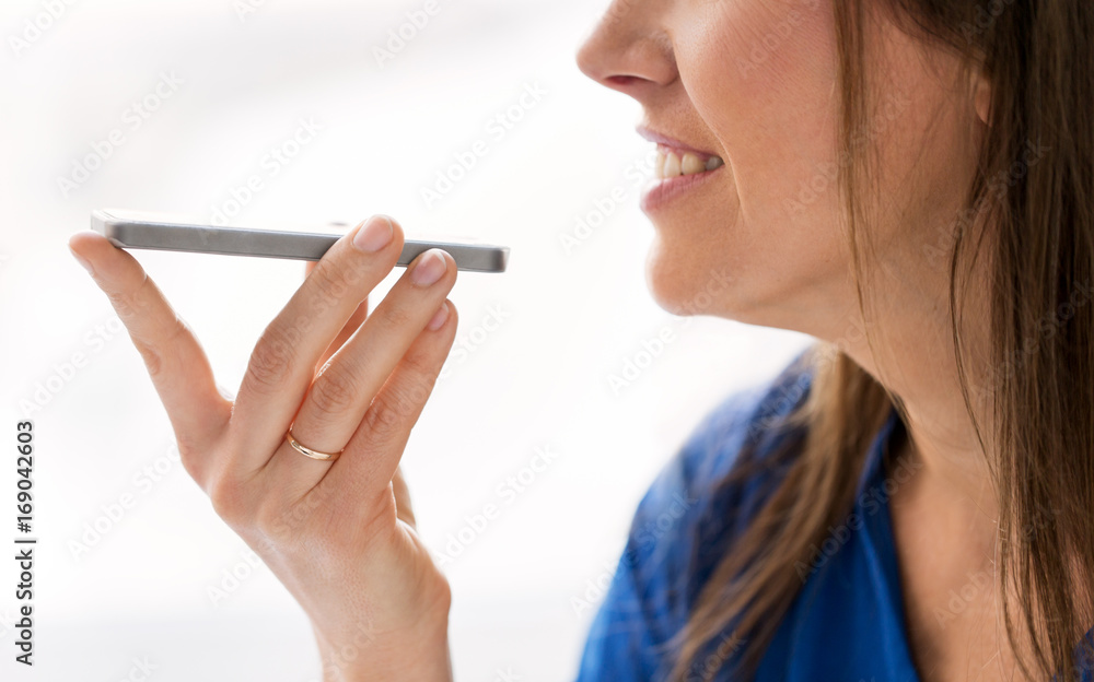 Obraz premium woman using voice recorder on smartphone