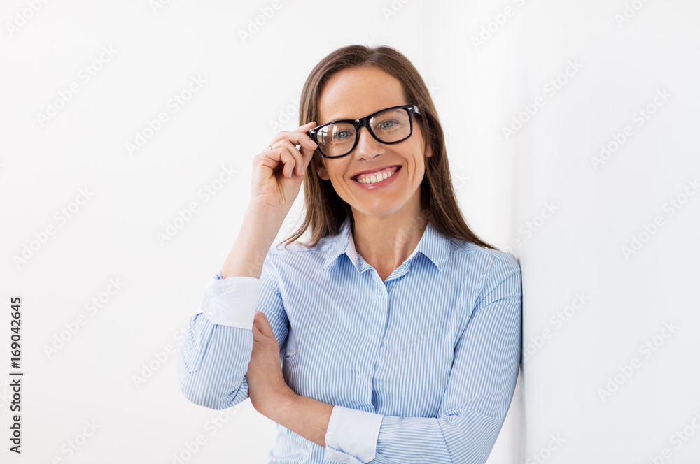 happy smiling middle aged woman in glasses