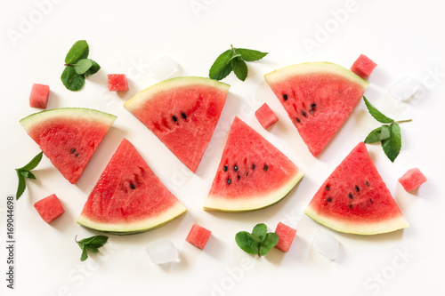 Slice of watermelon, mint ice on a white background.