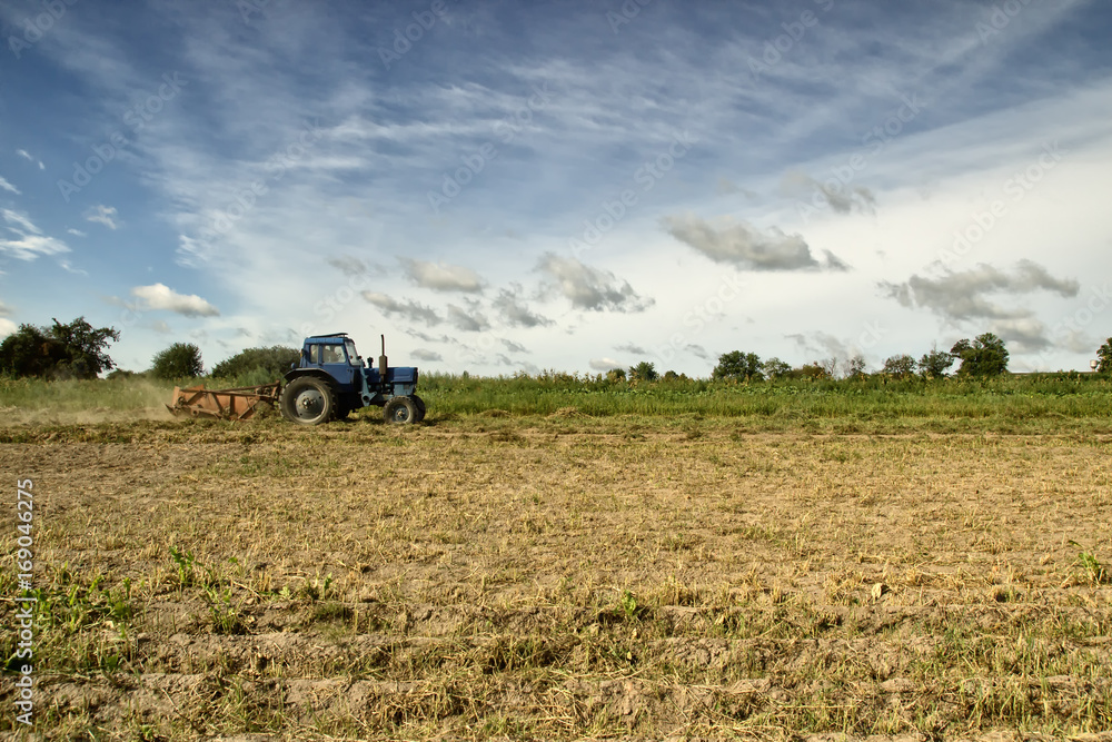 Fototapeta premium Tractor in the field