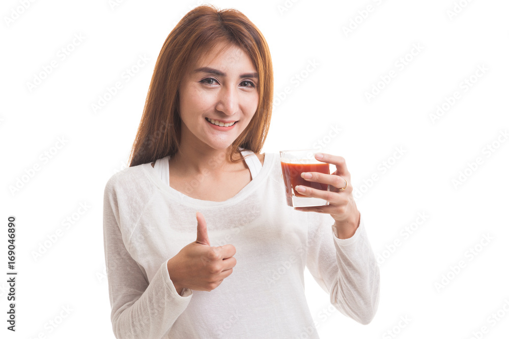 Young Asian woman thumbs up with tomato juice. Young Asian woman thumbs up with tomato juice.