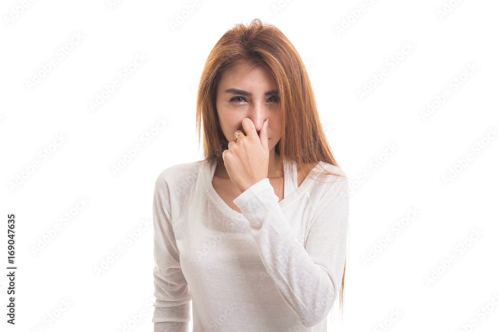 Young Asian woman holding her nose because of a bad smell. Young Asian woman holding her nose because of a bad smell.