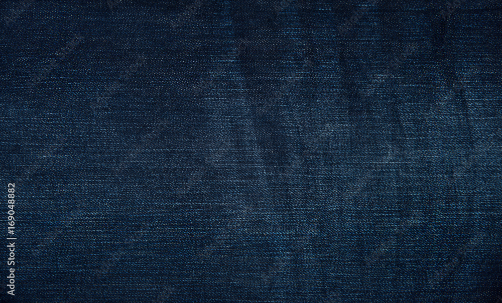 Denim grunge texture. Jeans close-up Denim grunge texture. Jeans close-up