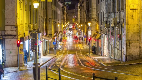 Night timelapse of the typical Lisbon street view with tramways and car traffic. Portugal. April, 2017