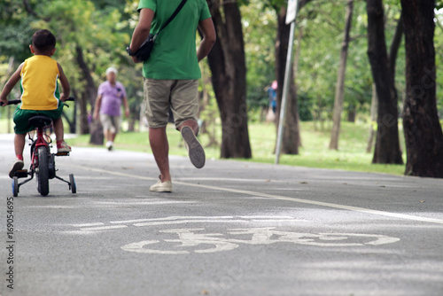 Wallpaper Mural Crowd of people exercising, running and riding bicycle in the national park on a beautiful Sunday morning Torontodigital.ca