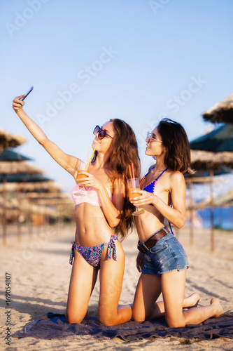 sexy girls having fun on a beach