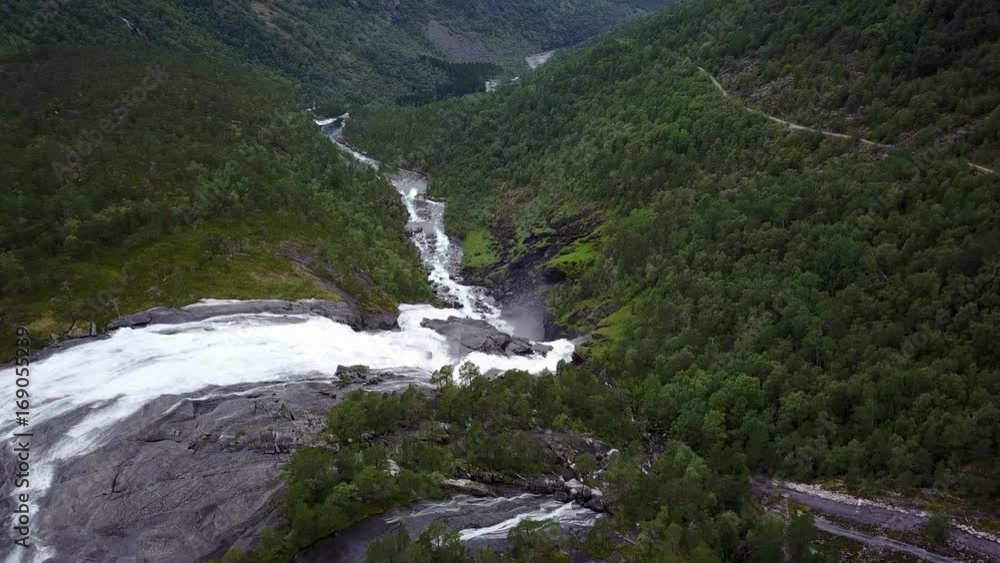 Waterfall in mountains of Norway in rainy weather from air view from drone Waterfall in mountains of Norway in rainy weather from air view from drone