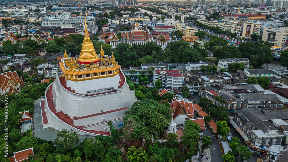  'Golden Mountain '  Wat Saket Ratcha Wora Maha Wihan popular Bangkok tourist attraction , Landmarks of bangkok Thailand . In the rain before , topview