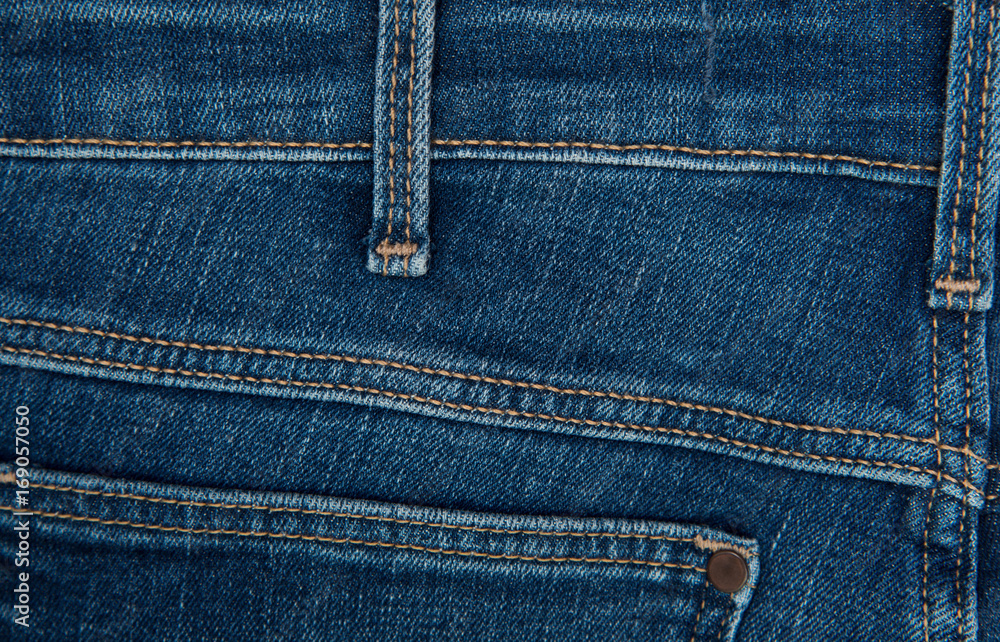 Denim grunge texture. Jeans close-up Denim grunge texture. Jeans close-up