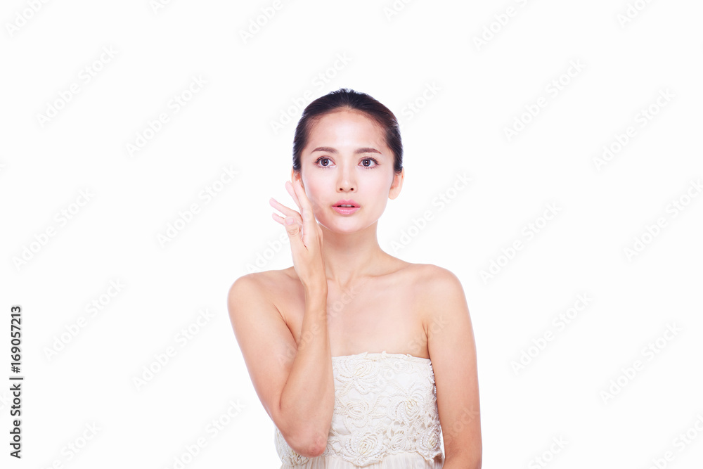 Close up Asian women Are happy Between skin care and her face. With skin cream and skin spa. skin care and spa concept. Close up Asian women Are happy Between skin care and her face. With skin cream and skin spa. skin care and spa concept.