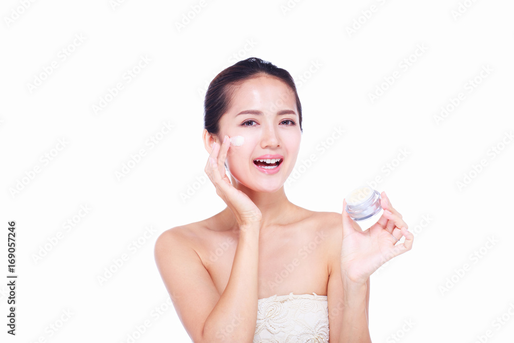 Close up Asian women Are happy Between skin care and her face. With skin cream and skin spa. skin care and spa concept. Close up Asian women Are happy Between skin care and her face. With skin cream and skin spa. skin care and spa concept.