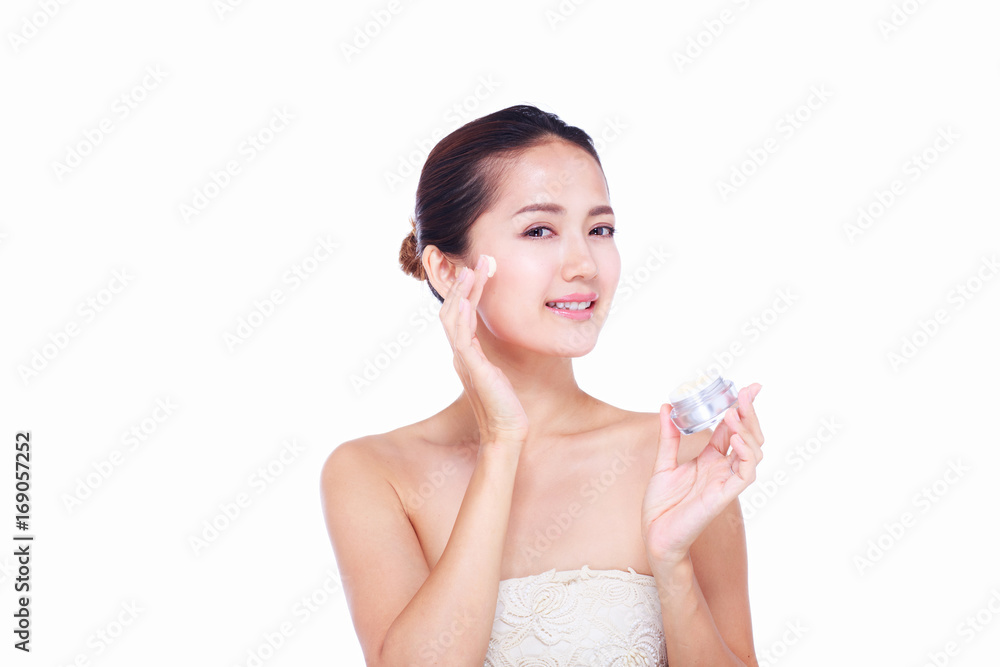 Close up Asian women Are happy Between skin care and her face. With skin cream and skin spa. skin care and spa concept. Close up Asian women Are happy Between skin care and her face. With skin cream and skin spa. skin care and spa concept.