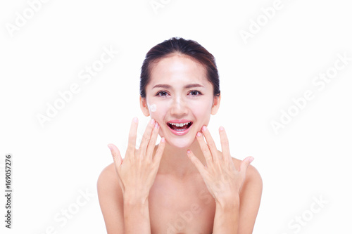 Close up Asian women Are happy Between skin care and her face. With skin cream and skin spa. skin care and spa concept.