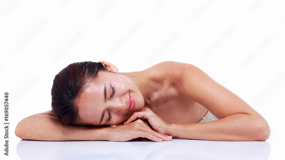 Close up, Beautiful Asian woman sleeps after cleansing her skin and skin care. Skin care and spa concept. Close up, Beautiful Asian woman sleeps after cleansing her skin and skin care. Skin care and spa concept.