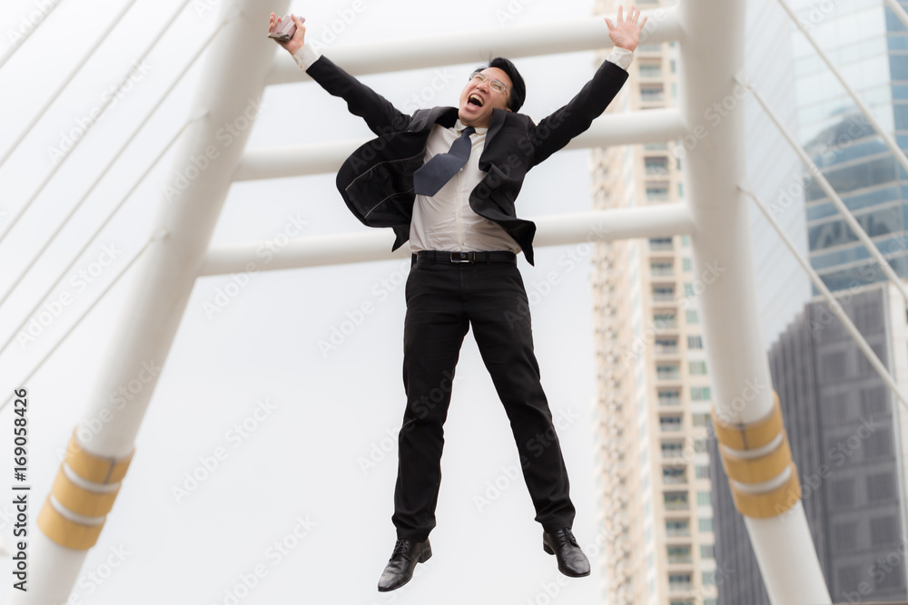 Fototapeta premium CEO businessman jumping celebrating after him work success
