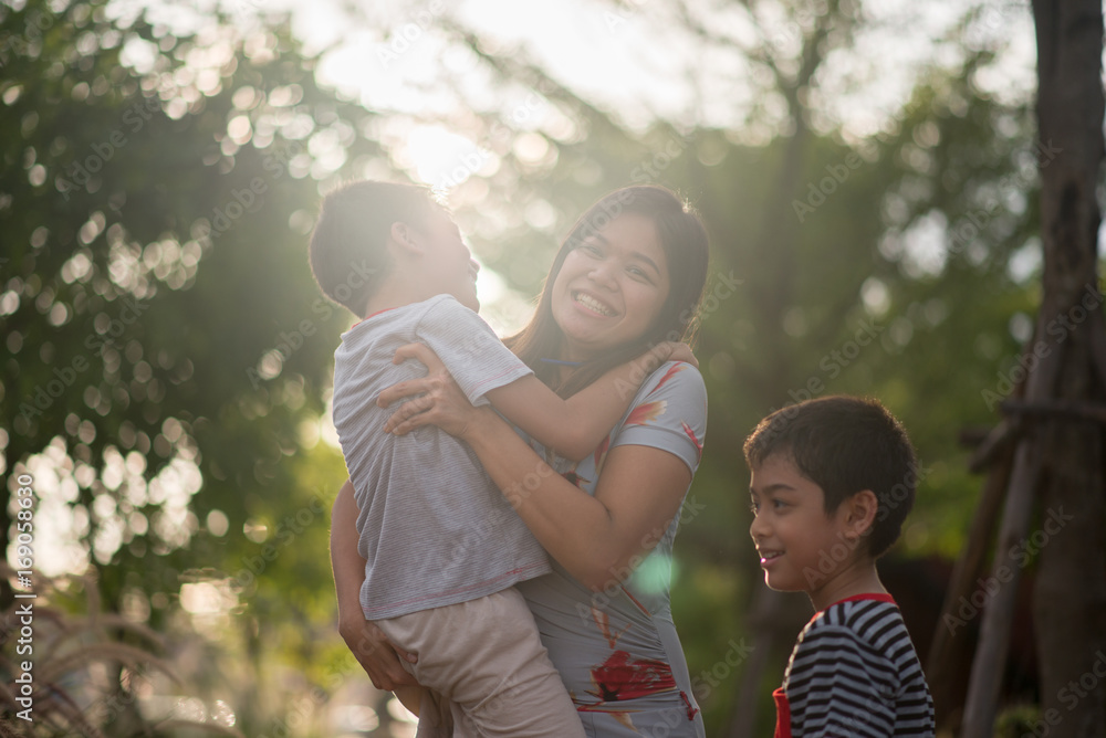 Fototapeta premium Single mom walking with son together with happy face