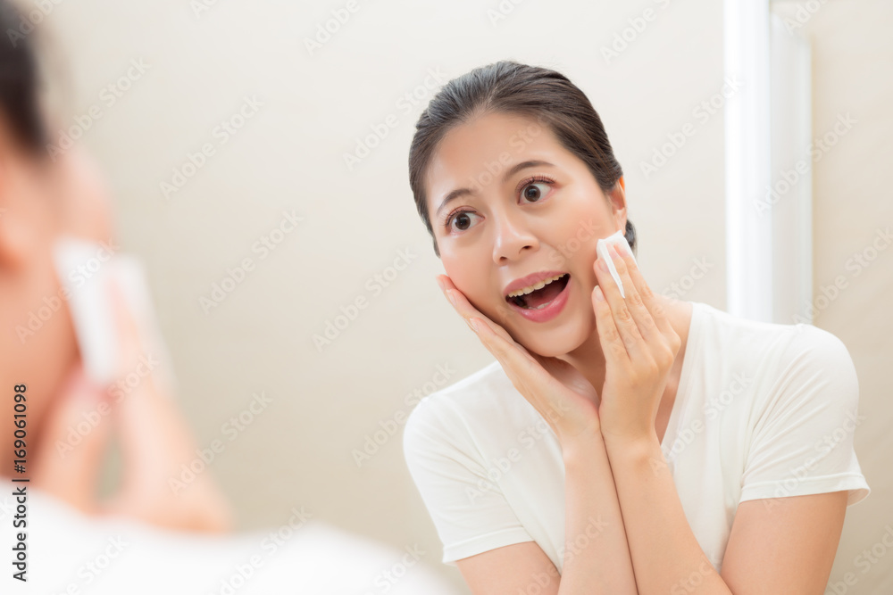 smiling female student happily looking at mirror smiling female student happily looking at mirror