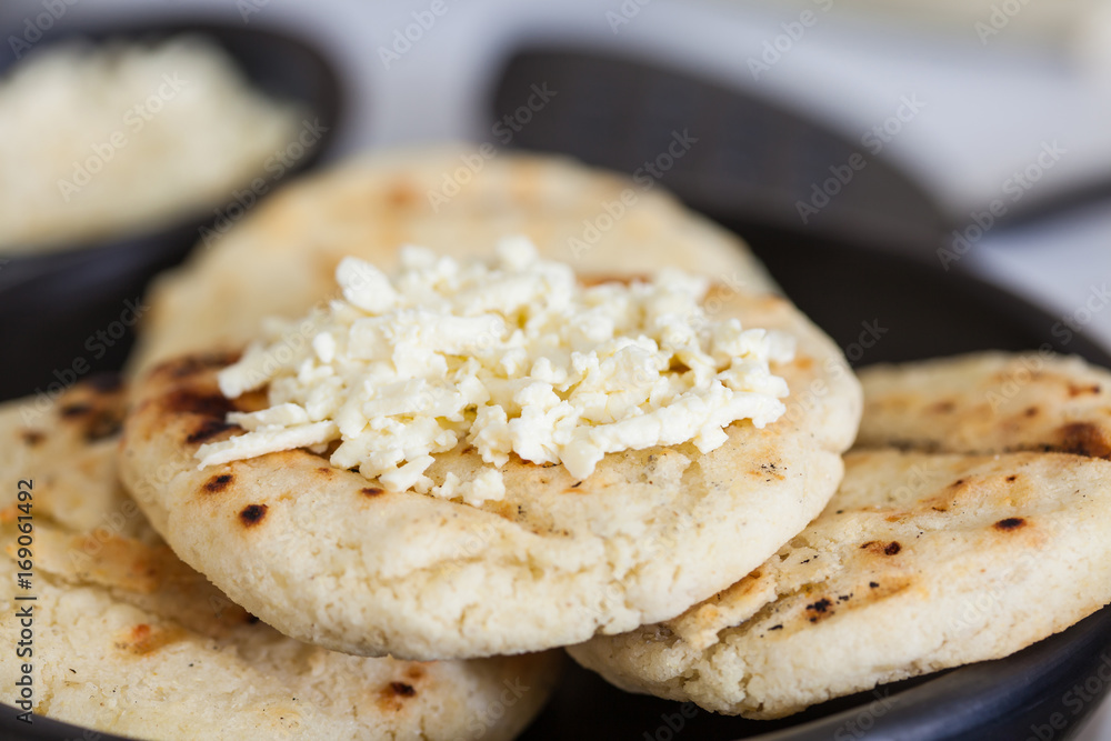 Traditional Colombian white corn arepa with cheese Traditional Colombian white corn arepa with cheese