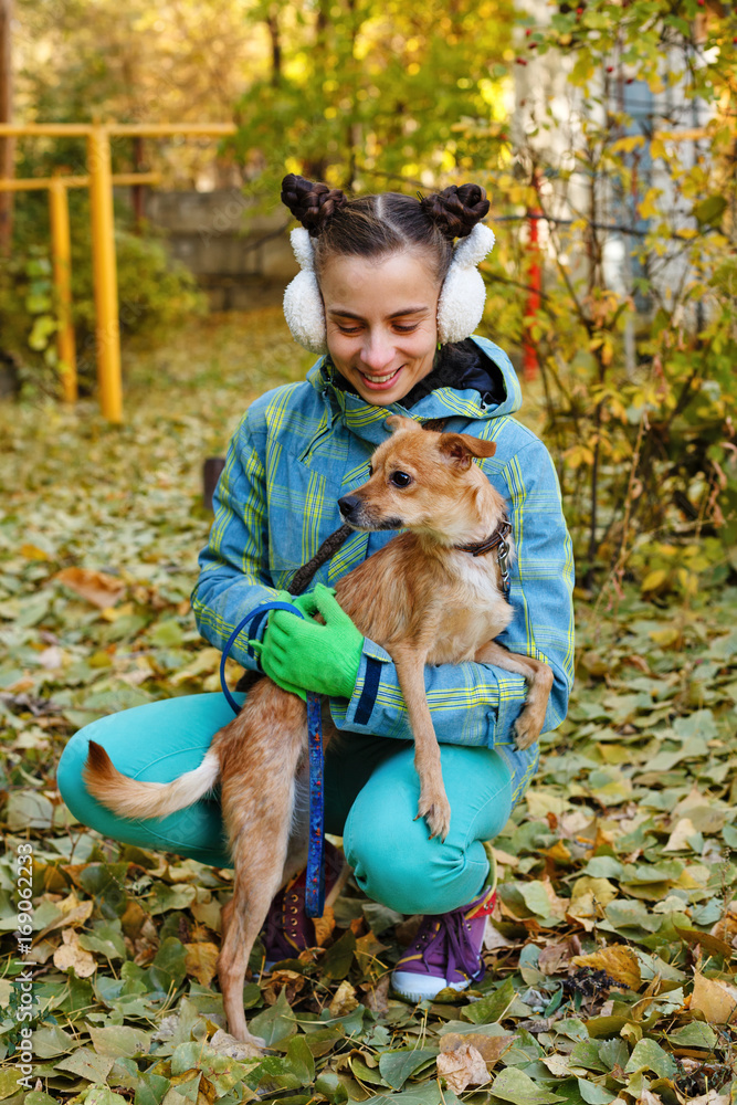 The girl and small dog. Autumn The girl and small dog. Autumn
