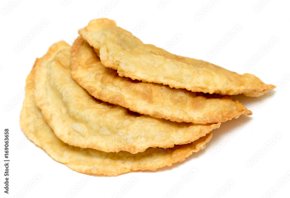 Cheburek - traditional dish of many Turkic and Mongolian peoples, isolated on white background Cheburek - traditional dish of many Turkic and Mongolian peoples, isolated on white background