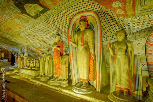 12 Century Dambulla Cave Golden Temple And Statues. Dambulla Cave Golden Temple Is The Largest And Best-Preserved Cave Temple Complex In Sri Lanka photo