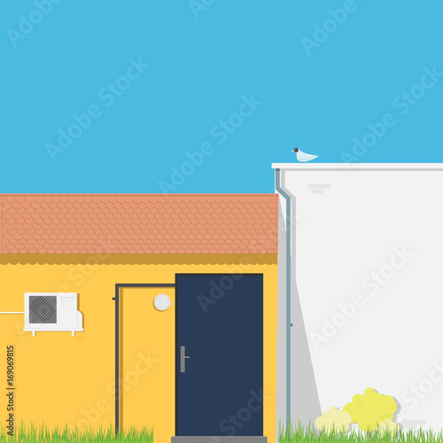 Yellow and white wall with dark front door