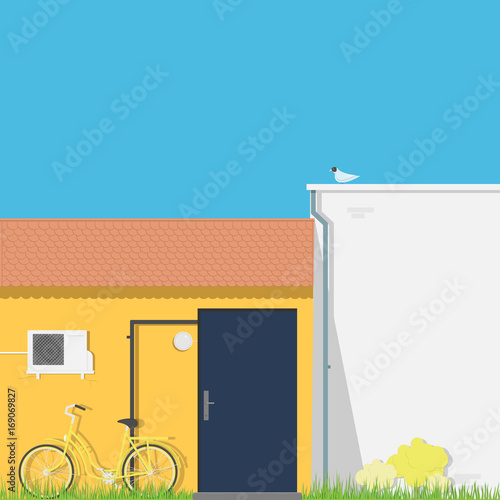 Yellow wall with dark front door