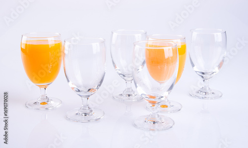 Orange juice in glasses on white background.