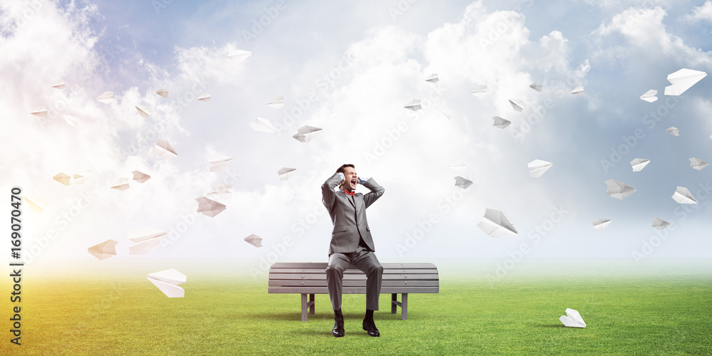 Young man in suit in park dont want to hear anything Young man in suit in park dont want to hear anything