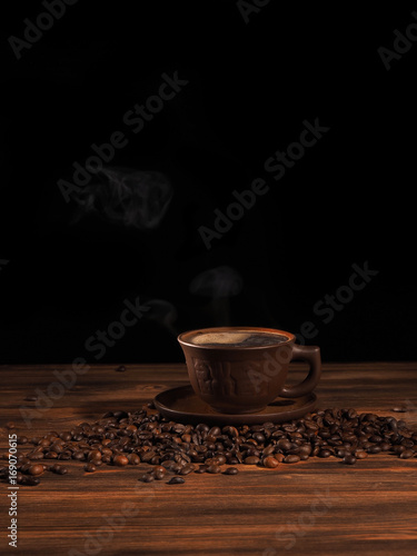Coffee cup on a wooden backgound.