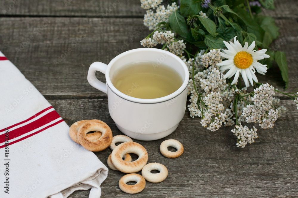 a cup of herbal tea with bagel
a cup of herbal tea with bagel