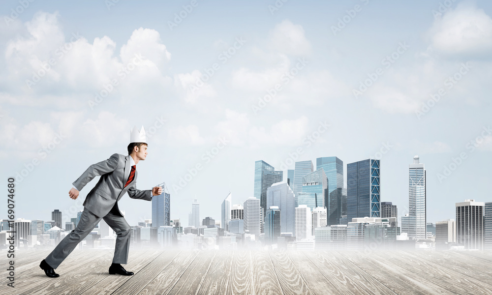 King businessman in elegant suit running and modern cityscape at background King businessman in elegant suit running and modern cityscape at background