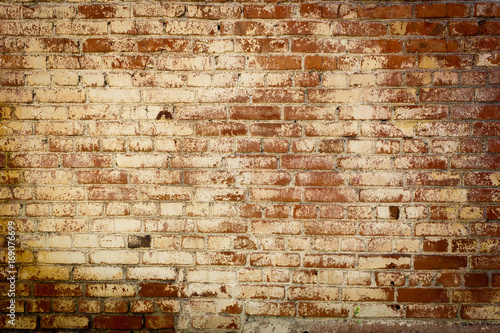 Old colored brick wall texture grunge background