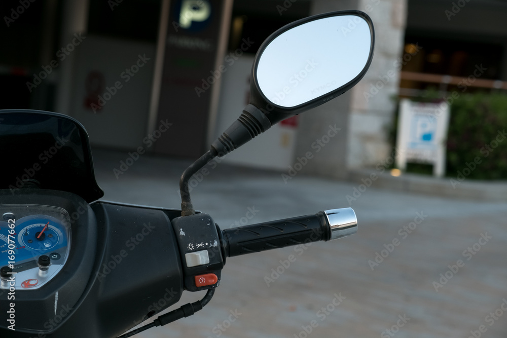 motorcycle scooter. scooter with headlight handlebar and mirrors selective focus. motorcycle scooter. scooter with headlight handlebar and mirrors selective focus.
