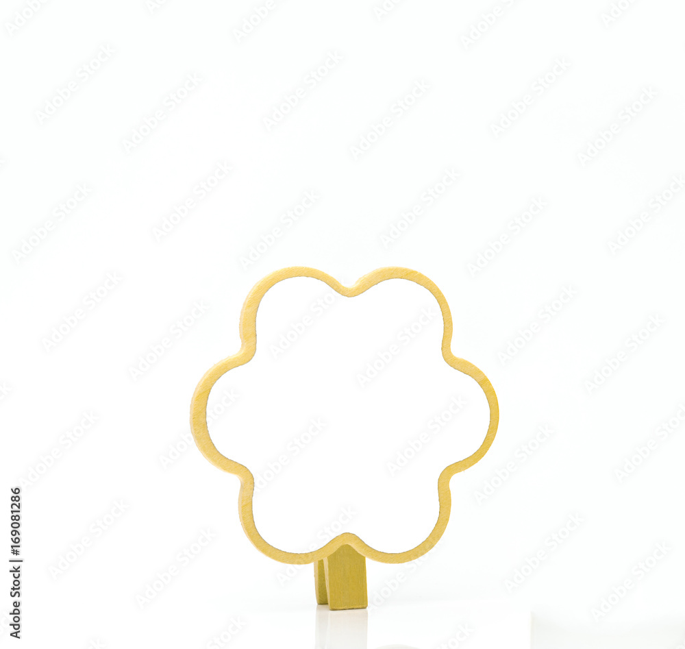 Vertical paper clip made of wood with copy space on white background Vertical paper clip made of wood with copy space on white background