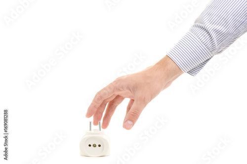Male hand holding a tee in a white socket