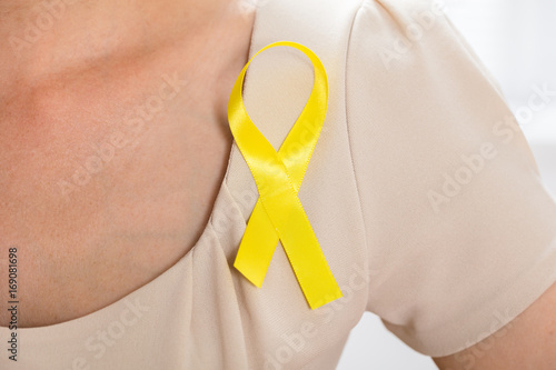 Woman With Gold Ribbon To Support Breast Cancer Cause