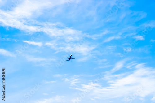 Airplane in the cloudy sky. Travel concept