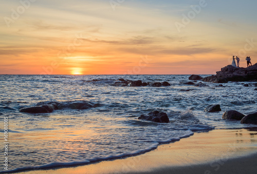 Sunrise or Sunset over the sea view from tropical beach with orange sky