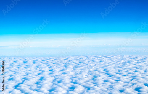 Blue sky and Cloud Top view from airplane window Nature background