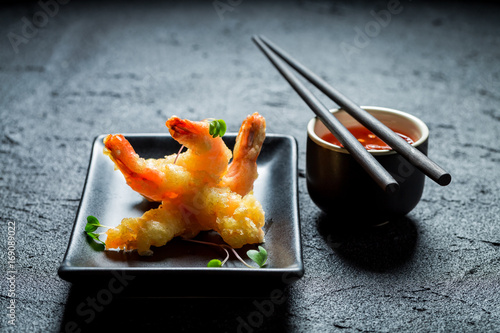 Closeup of shrimp in tempura on black rock