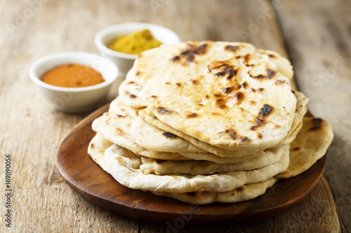 Indian naan bread on wooden desk photo