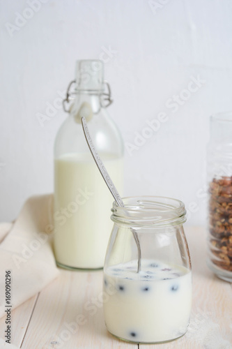 Healthy breakfast. Fresh granola, muesli in a glass jar.Organic oat, fresh berries.