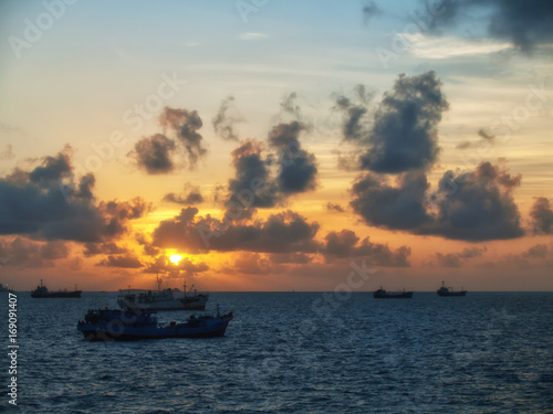 Several boats anchored at sunset © David