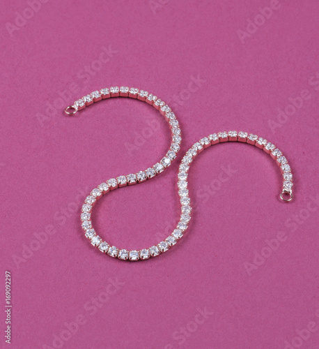 Beautiful necklace on a magenta backdrop