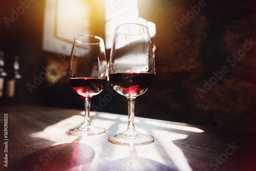 Red wine in glasses, wine tasting concept photo